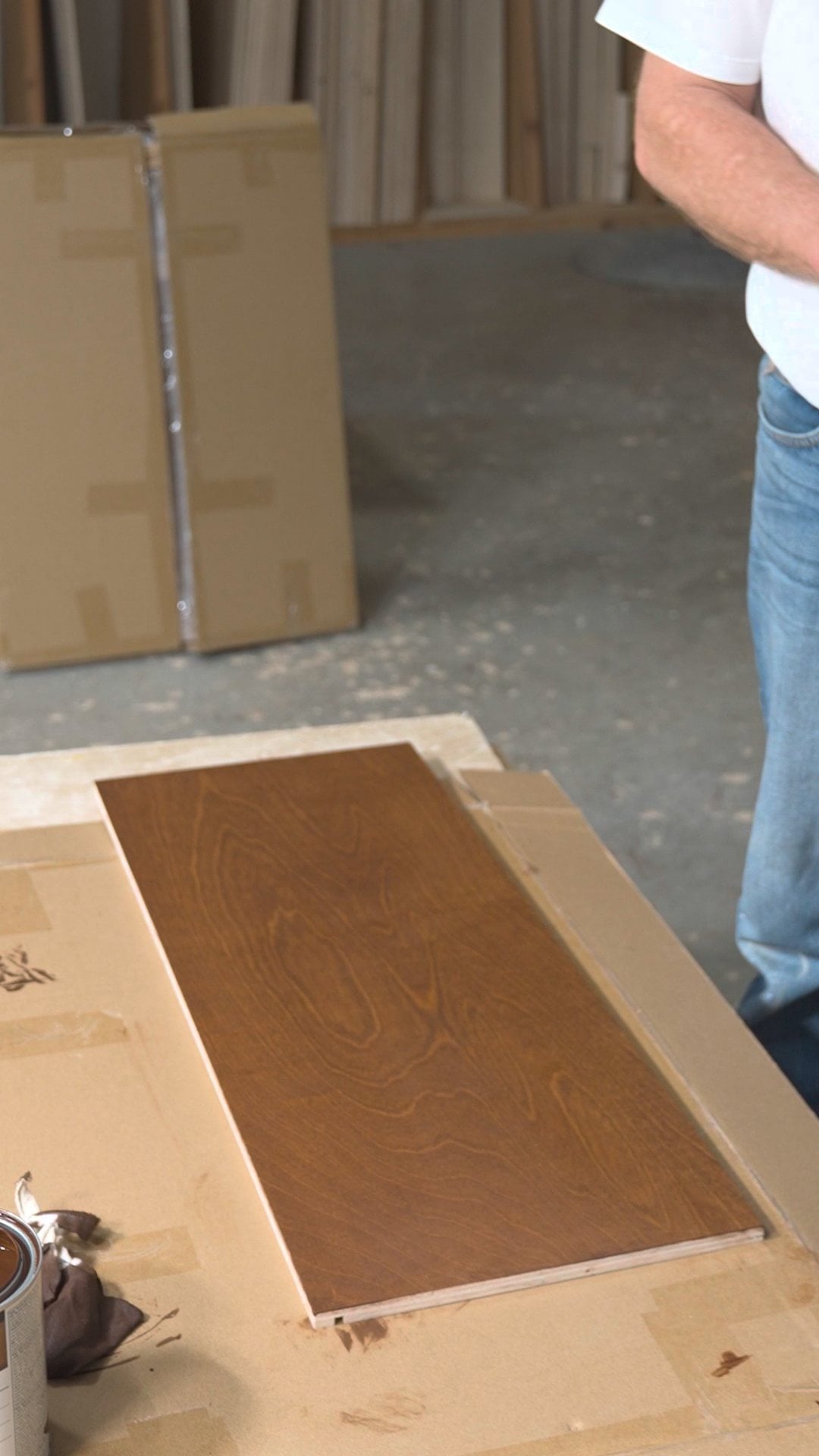 The same cabinet panel with an even stain color after re-wetting and wiping