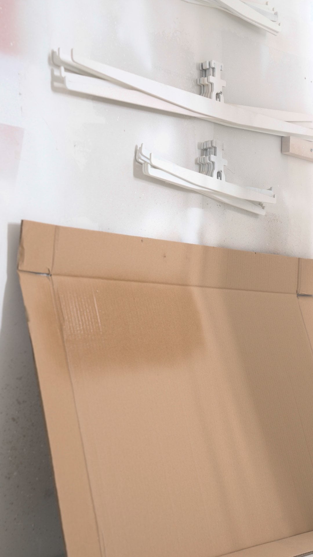 A test pass on cardboard showing a fan pattern about six inches wide